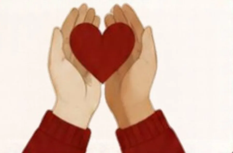 Two hands holding a red heart.