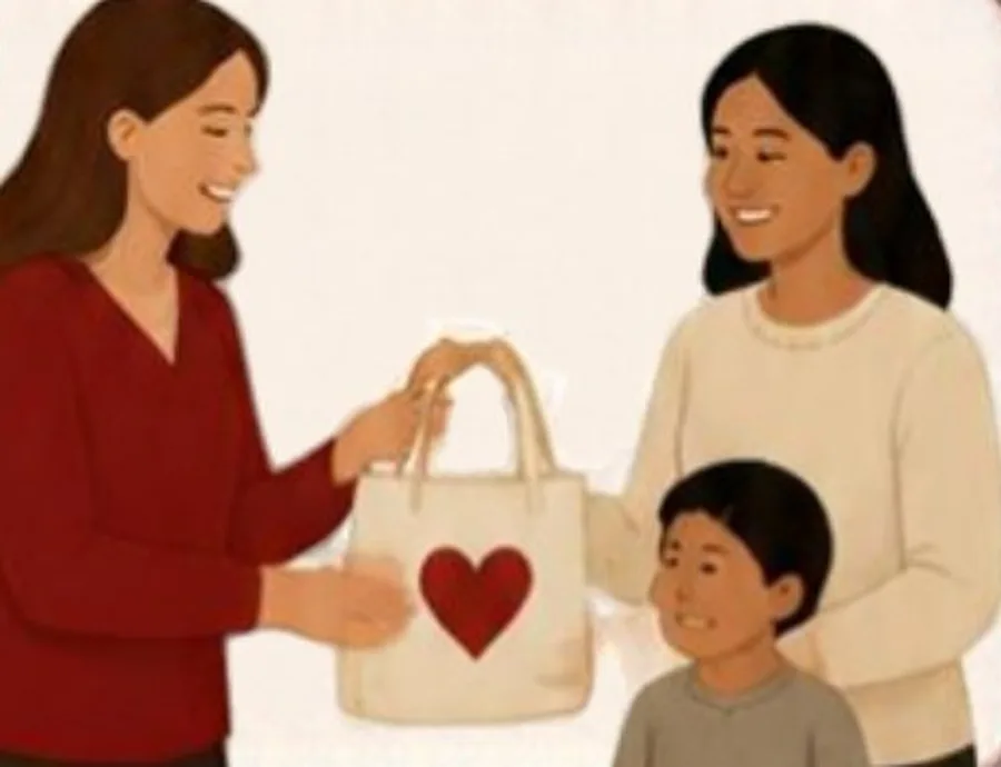 A woman handing a tote bag to a mother and child.